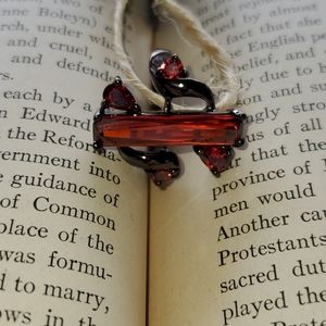 Black gold red zircon ring